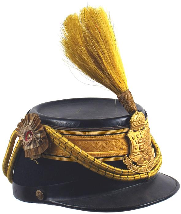 Hungarian Infantry Faehnrich shako helmet: E-17 Hungarian Infantry "Faehnrich" shako. Austrian style black felt body with a yellow-gold 1 3/4" wide designed fabric band around crown. Black leather top and visor. Brass relief eagle side buttons