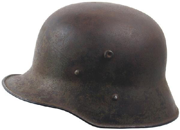 Austrian WWI M1916 helmet: E-20 WWI Austrian M1916 helmet. Some scattered areas of light green paint. Light pitting on top and inside, small section of leather strap/buckle still attached. (Found in Afghanistan). III