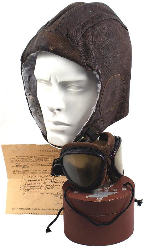 Japanese WWII Navy pilot summer flight helmet: E-74 Japanese Navy pilot's brown leather summer flight helmet. Maker's and issue labels on molted rabbit skin lining. With pilot's goggles. Metal frames with cushioned velvet linings. Elastic band. Wi