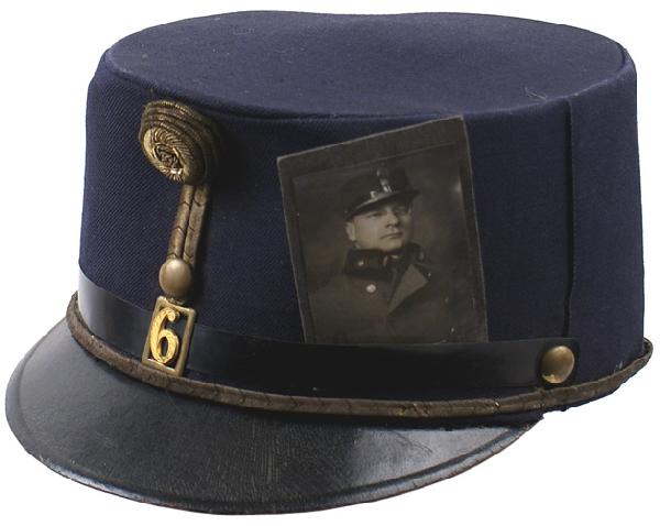 Austrian Uhlan Officer 6th Regiment M1916 cap: E-111 Uhlan Officer 6th Regiment Model 1916 dark blue field cap. Similar to above – but with a gilt number "6" and gold bullion "FJ1" rosette at the top of the vertical gold bullion cord. Leather sw