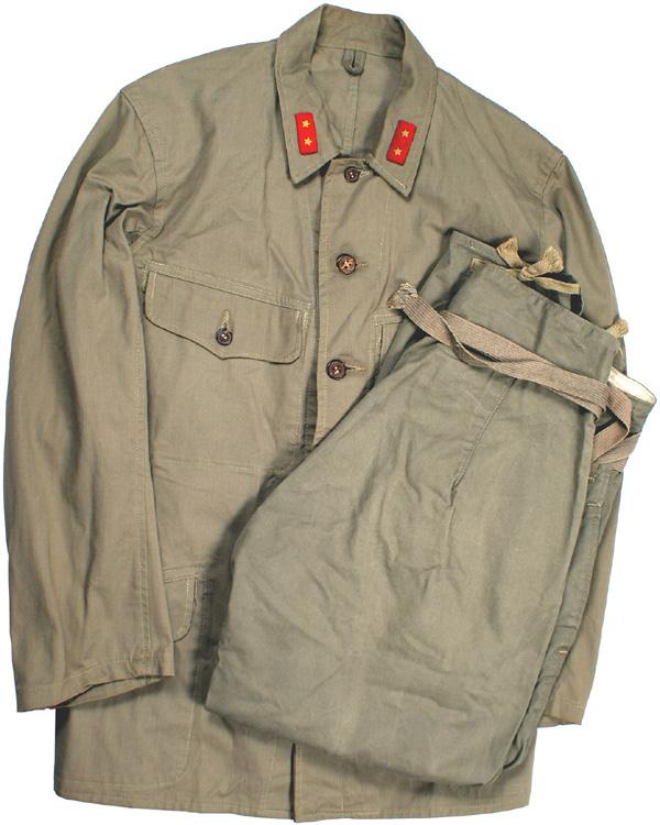 Japanese WWII EM tropical uniform: F-133 Japanese WWII EM tropical uniform. O.D. cotton four-pocket tunic. Private 1st Class collar tabs. Character stamping on inside of back. Plastic type buttons. With unissued bree