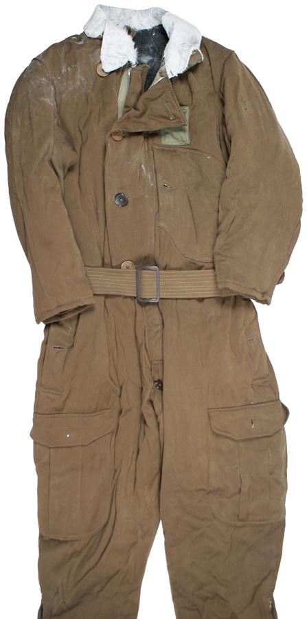 Japanese Navy pilot winter flying suit: F-136 Japanese Navy pilot's winter flying suit. One-piece brown cloth, with a zipper front. Green cloth square, as above, sewn on left chest. Large chest pocket, two side and two la