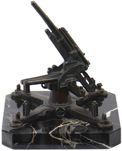 Bronzed model 88 Flak gun desk stand: G-11 Nicely detailed bronzed model of an 88 Flak gun. Four leg stabilizers with a turned-up weapon which rotates on the 6" diameter base. Overall 5 3/4" tall. II