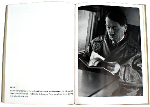 Adolf Hitler book DAS ANTLITZ DES FUHRERS: A-18 "DAS ANTLITZ DES FUHRERS". Heinrich Hoffmann pictorial with full page photos of Hitler profiles between 1919 and 1939. Inside of cover has a sepia toned "Adolf Hitler" bookplat