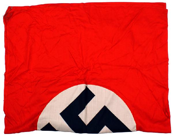 German WWII NSDAP flag: H-100 NSDAP flag. Printed black swastika on a white disc – sewn to a red field. With a pole sleeve. 30" x 35". II
