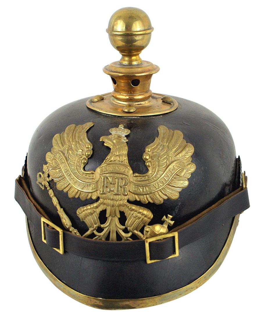 Imperial Prussian Artillery Other Ranks helmet: E-020 Imperial Prussian Artillery Other Ranks helmet. Solid black leather body. Brass eagle front plate, round ball top/base, spine, visor trim and fittings on a replaced black leather chinstrap. Nati