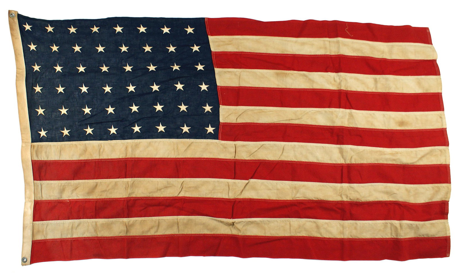 US WWII 48 star flag: H-115 US WWII 48-star flag. Relief embroidered stars on both sides. 32" x 56". Zinc grommets. Some stains on border. II