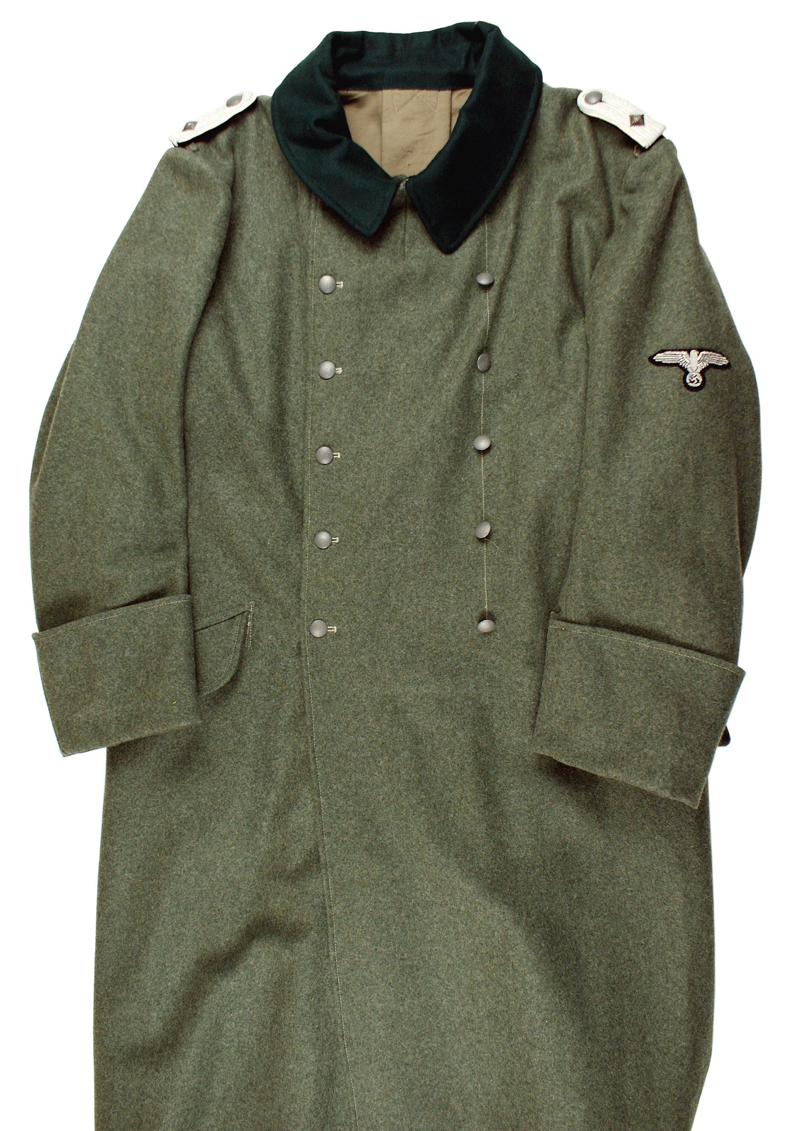 Repro German WWII Army overcoat: H-165 Reproduction German WWII Army overcoat. OD wool with a dark green collar. Slip-on SS 2nd Lieutenant shoulder boards. Reproduction silver bullion embroidered sleeve eagle/swastika. Two rows of si