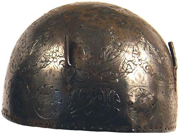 Indo-Persian Kulah Khud helmet: R-4 Indo-Persian “Kulah Khud”. Round steel skull engraved with circular floral panels and intricate designs. Two plume sockets affixed to front. Bottom border is perforated to accommodate a chain 