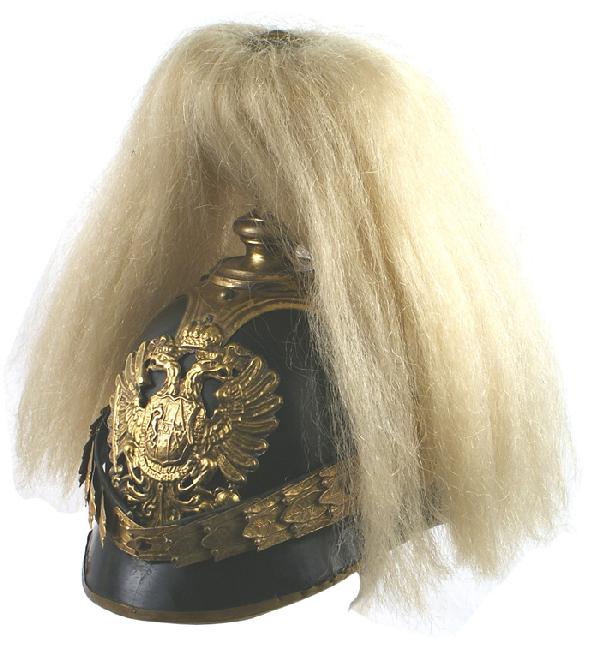 Austrian Lifeguard Infantry Company helmet: E-1 Helmet for officers in the Lifeguard Infantry Company. Black lacquered body with gilt brass laurel leaf chinscales, lion head bosses, tiered spike base, extended cruciform base with domed studs (t