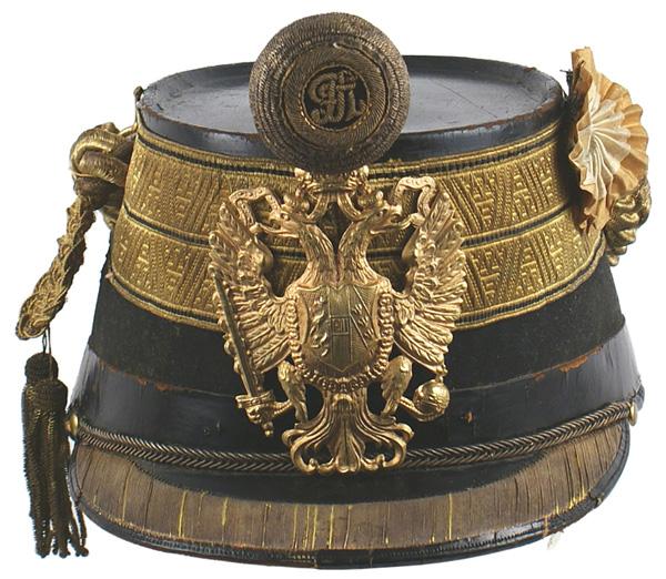Austrian Colonel shako helmet: E-11 Austrian Colonel’s shako. 2 1/8” wide linear designed flat gold band, with three black stripes around black felt body. Quality gilt brass crowned double-headed eagle front plate. Twisted bull