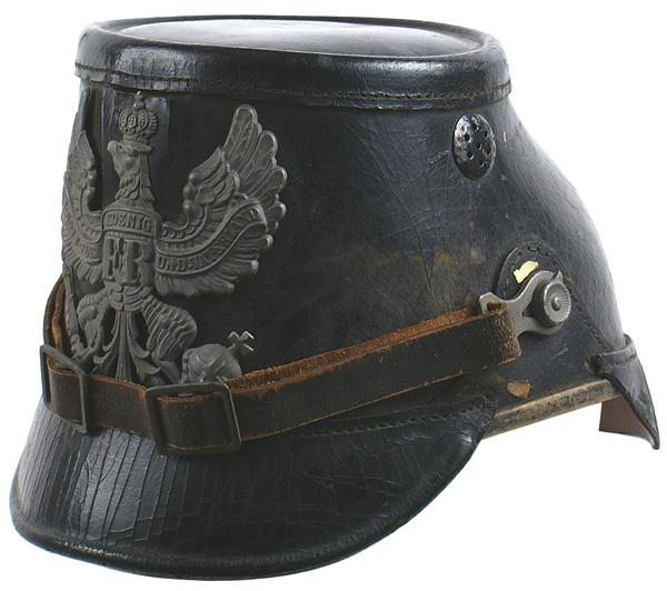 German Prussian WWI Jaeger shako: E-26 Prussian Other Ranks black leather Jaeger shako. Original black leather chinstrap. National Colors rosette. Correct smaller type gray Prussian eagle frontplate. Tan leather drawstring liner with 