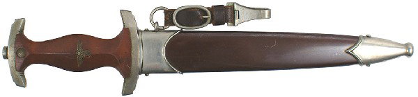 German WWII SA dagger: D-7 Same as above. Copper eagle in grip. Aged patina on crossguards, bottom one is marked “Sw” (SUDWEST). Blade is marked with a crowned “K” logo and “CARL JUL. KREBS – SOLINGEN”. The or