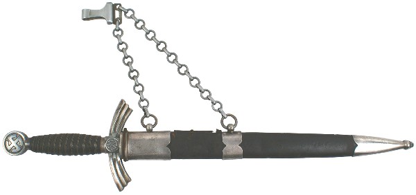German WWII Luftwaffe 1st Model dagger: D-19 Luftwaffe 1st Model. Wire wrapped blue leather grip. “Sun wheel” swastika on pommel and on both sides of the center of the down-turned nickeled wings. Fairly clean 12 1/8” blade marked with