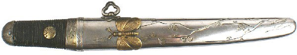 Japanese Samurai Tanto dagger knife: D-79 Tanto. 7 ¼” straight clean blade with a fairly high “waves” temper line. Most of silver on habaki remains. Narrow cord wrapped grip was blackened. Some engraving on brass circular tang hol