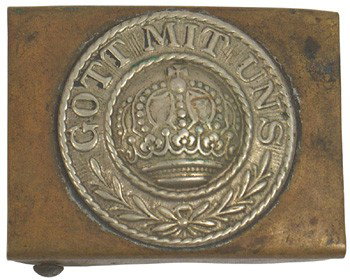 Prussian German WWI belt buckle: H-1 Prussian WWI. Silvered roundel, with a crown/oak leaves/"GOT MITT UNS" on a brass backing. Age-toned. II