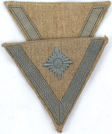 Lot of 2 German WWII AK chevrons: H-64 Lot of 2 AK chevrons: Gefreiter and Obergefreiter. Both with gray tress/embroidery on HBT tan material. II+