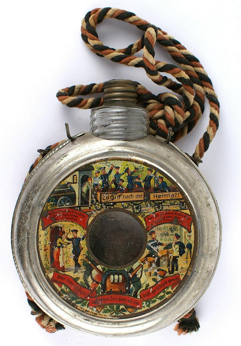 Imperial German souvenir reservist flask: G-002 Imperial German souvenir reservist's flask. Glass body encased in a metal frame decorated with scenes of military life and a panoply of military symbols, including an enameled "118" epaulette. U