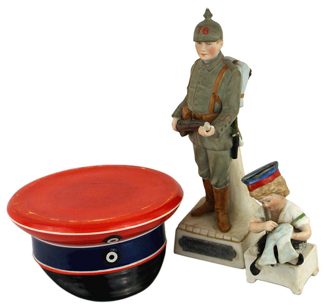 3 German WWII art items hat/statue/etc: G-006 Lot of 3 German WWI related statuary items: (1) Porcelain peaked cap - red body, blue band and white piping. 3 3/8" diameter when layed on its top and acts as an ashtray. (2) Colored bisque 6 1/