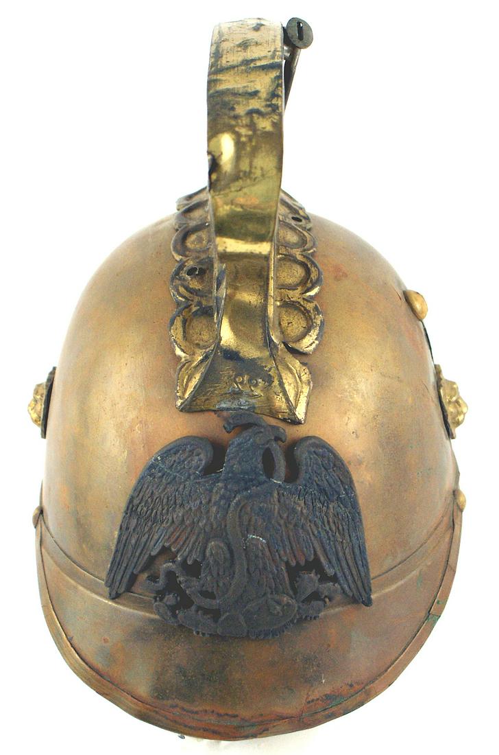 Composite antique Mexican Fire Department helmet: E-031 Composite antique brass Mexican Fire Department Helmet. Good solid age toned body (3/4" surface split on back left side and 1 1/2" split on side). 3 3/4" high brass comb with indented fluting. L