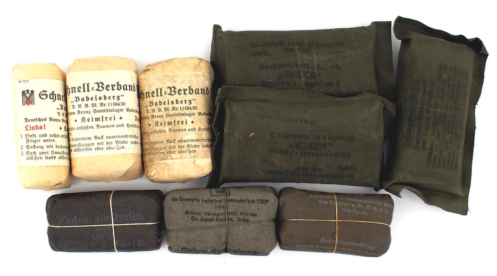 9 German WWII unopened shell dressings: N-011 Lot of 9 German Third-Reich unopened shell dressings: (1) 3 with Red Cross/"1938"/"Babelsberg" labels. (2) 3 - Army "1943" large type, (3) 3 - Army small type - "1943" and "1944". I