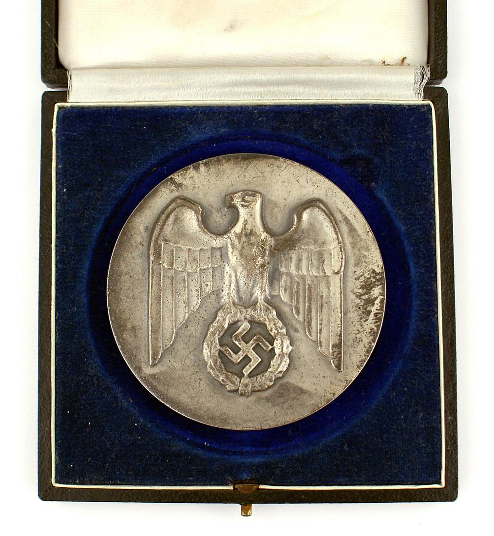 German WWII Hitler Youth table medal: B-020 Hitler Youth table medal. Relief eagle/swastika on obverse Reverse is relief inscribed "1st Prize for the victor of the Hitler Youth Leader's Competition in Bann Judenburg - January 1939 (from) 