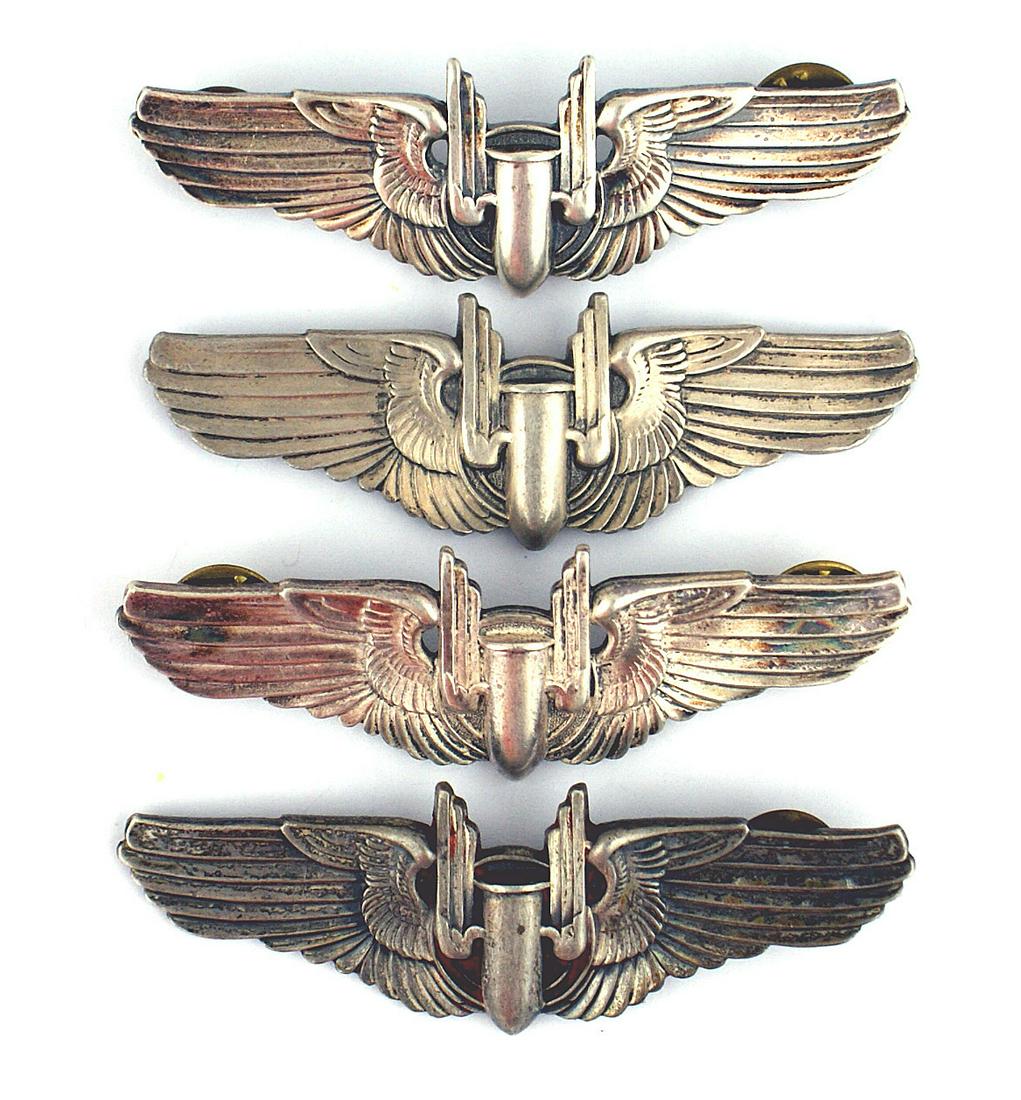 Lot of 4 US WWII STERLING Aerial Gunner Wings: B-182 Lot of 4 U.S. WWII "STERLING" clutch - back Army Air Force Aerial Gunner Wings. One is missing a post pin, another is missing two. II