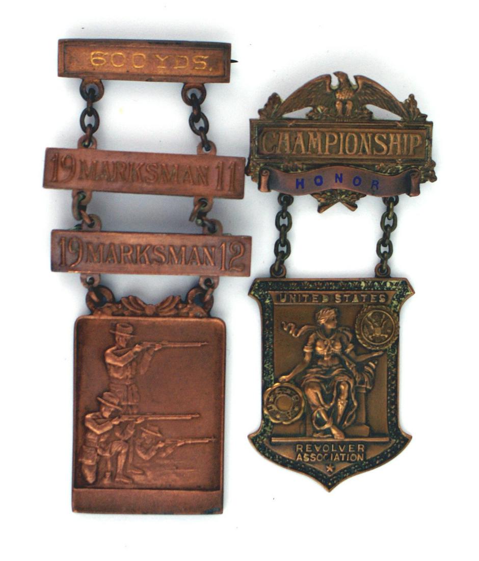 Lot of US shooting awards Revolver: B-202 Lot of 2 bronze shooting swasrds: (1) U.S. Revolver Association - "CHAMPIONSHIP". Named to "John O. Holshouse". (2) "600 yds." Engraved pin-back bar with chain suspended "19 MARKSMAN II" and 191