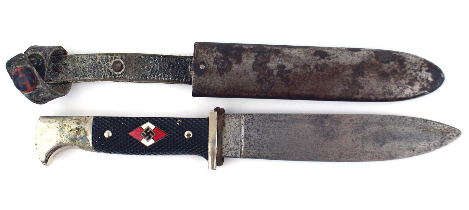 German WWII HJ Hitler Youth dagger: D-009 German Third-Reich HJ (Hitler Youth) dagger. Nickeled "bird - head" pommel and crossguard (turned up tip broken off. Enameled HJ diamond/swastika set into the checkered black plastic grip. 5 3/8