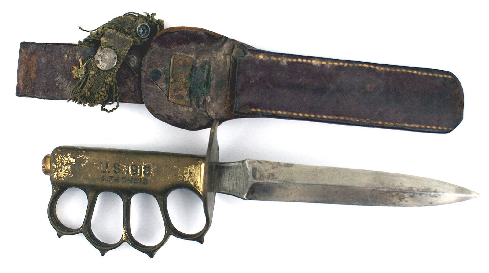US WWI trench knife LF & C: D-024 US WWI trench knife. One-piece darkened brass handle/"knuckles" and rounded guard. Handle marked "US 1918 - L.F. & C. - 1918". The large domed brass pommel screw indicates a WWII manufacturer. T