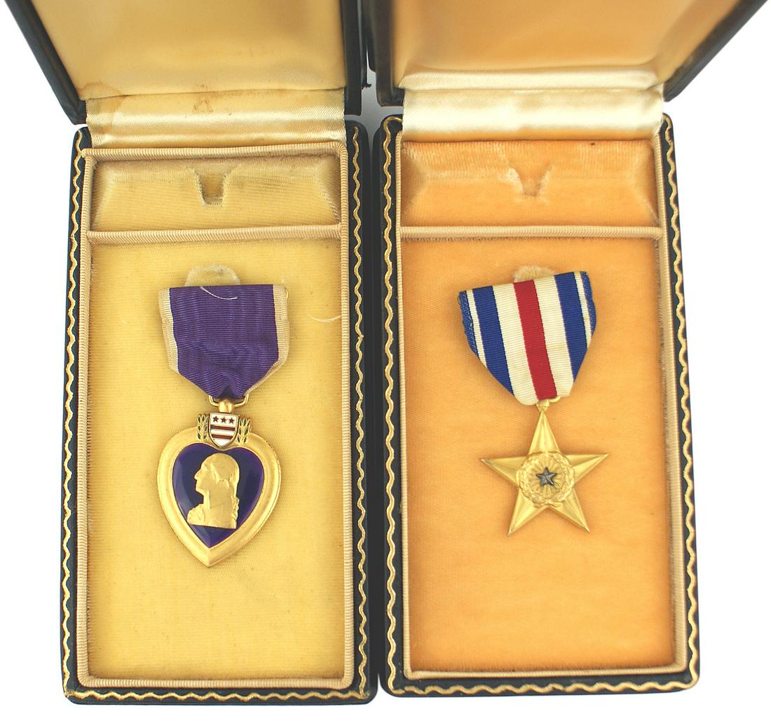 US medals 116th Infantry 29th Division Normandy Invasion: A-022 Rare pair of medals awarded for actions by Sgt. Carl W. Raymond, a member of the 116th Infantry, 29th Division during the Normandy Invasion on June 6, 1944. Sgt. Raymond's boat team was pinned d