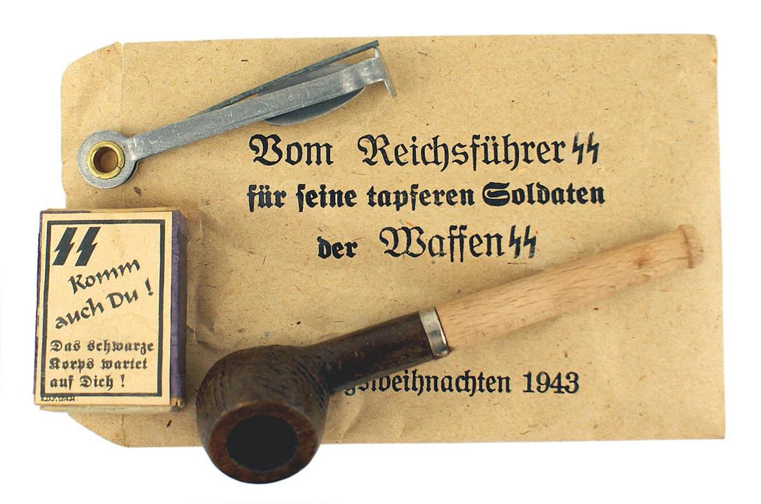 German WWII Christmas gift pipe Waffen SS: H-066 Christmas gift pipe to members of the Waffen-SS. Wood bowl/stem with an iron ring which shows age. Also with a tamper/packer and an "SS" labeled box of matches. Paper envelope reads "From the Re