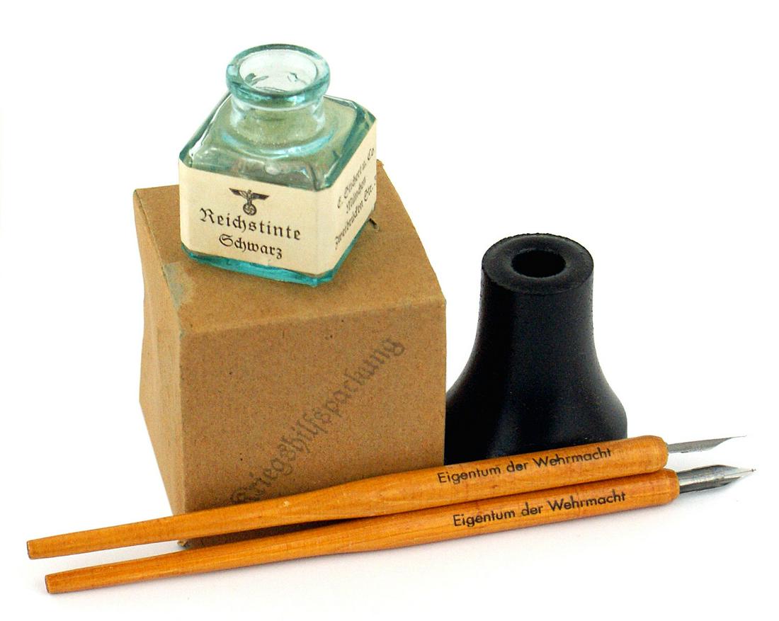 German WWII military desk ink well pens: H-068 German Third-Reich military desk implements: (1) Glass ink well with eagle/swastika,: "Reichstinte...". (2) Ceramic cylinder shaped ink well. Base marked with a eagle/swastika and "Wr. A. 343". 