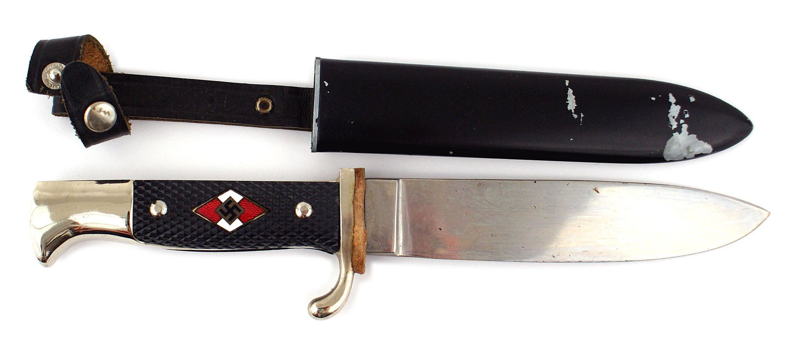 Reproduction German WWII HJ dagger: H-139 Reproduction German Third-Reich Hitler Youth dagger. Nickeled pommel and crossguard. Enameled HJ diamond with a swastika set into the checkered black plastic grip. 5 3/4" clean blade. Marked wit