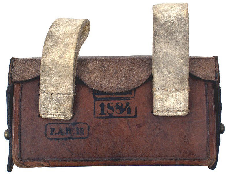 Prussian M1874 leather cartridge box: M-22 Prussian M1874 leather cartridge box. Hard brown leather with a hinged top, two side retaining straps and two white buff leather belt loops. Compartments for 20 cartridges. Reverse stamped "F.A.R