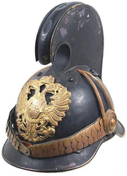 Austrian Dragoon M1905 NCO helmet: E-2 Austrian Dragoon M1905 Non-commissioned Officer's helmet. Black lacquered body with brass trim, large double-headed eagle frontplate, chinscales and side bosses with "teardrop" fixtures and top co