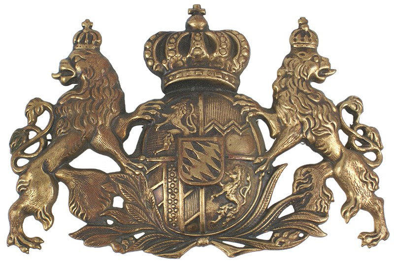 German Bavarian helmet plate: E-31 Bavarian helmet/cartridge box plate. A crowned State coat-of-arms flanked by a standing crowned lion on each side. 3 ½" x 5". Age-toned. II
