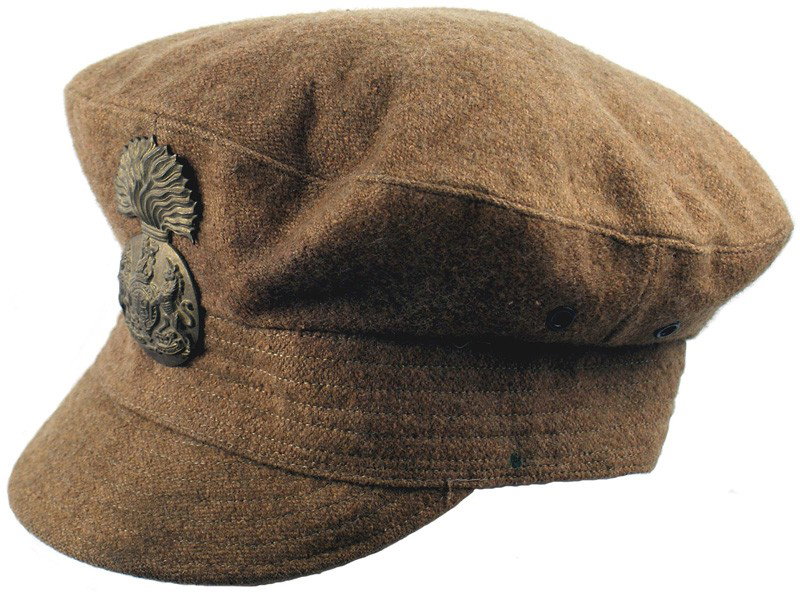 British WWI Officer field cap: E-150 British WWI Officer's field cap. Brown wool body, band and "folding" brim. Two side vents on each side. Large brass flaming grenade badge with a relief British coat-of-arms - pinned to front. Gr
