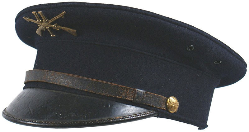 U.S. 1905 peaked cap: E-171 U.S. 1905 peaked cap. Dark blue with a black leather visor and chinstrap with gilt brass eagle buttons. Screw back brass crossed rifles/"11"/"I" badge. Black cloth lining with white stenciled cr