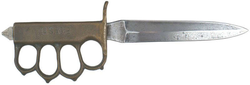 U.S. WWI M1918 trench knife: D-36 Same model knife as above - but made in France. Grip is marked "U.S. 1918". Round guard has been round off, probably during WWII when some of these knives were reissued. 6 ½" gray blade. II-