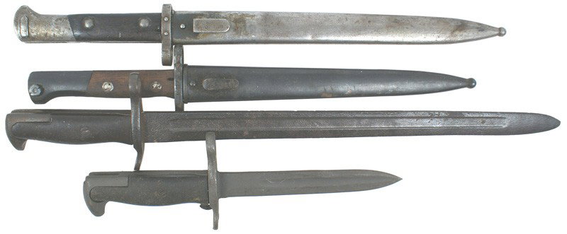 Lot of 4 bayonets Bulgarian Czech Mauser etc: D-113 Lot of 4: (1) Bulgarian Mauser. Blued pommel and crossguard. Wood grips. Excellent 100% dark blued 9 ¼" blade. Maker marked and dated "44". 95% bluing on scabbard. (2) Czech Mauser VZ 24. Metal