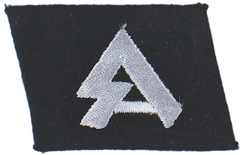 German WWII 18th Waffen-SS Horst Wessel collar tab: H-193 18th Waffen-SS Volunteer Panzer Grenadier Division "Horst Wessel" collar tab. Silver-gray silk embroidered "SA" runes. From the estate of a G.I. Warrant Officer who attended the War Crimes Trial