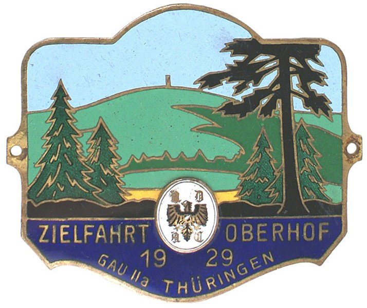 German Automobile Club enameled vehicle plaque: H-257 German Automobile Club enameled vehicle plaque. Gilt outlined 4-color trees/topography and "COMPLETION (of the) 1929 ROAD RALLY (to) OBERHOFF - Gau Ila THURINGEN". Also an applied enameled eagle
