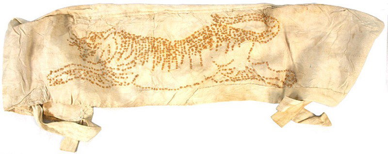 Japanese WWII Band of 1000 Stitches: H-293 Band of 1000 Stitches". Orange knots form a running tiger on a silk band. Folded over, the band measures 6 1/2" x 35 1/2". With silk ties. Blood stained. Worn in combat by aviators and Army pers