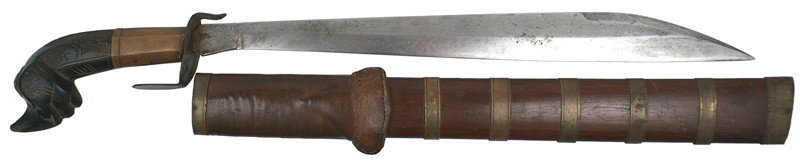 Interesting South Pacific short sword type weapon: R-41 Interesting South Pacific short sword type weapon. 17" golok shaped blade, but with the cutting edge on the top side. Carved wood effigy grip with a wide copper ferule and a wide, flat metal "S" 