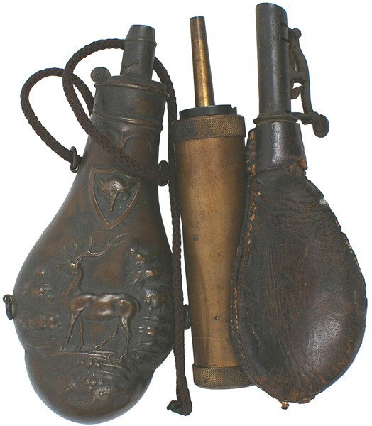 Lot of 3 rifle flasks: M-21 Lot of 3 flasks: (1) Violin shaped copper rifle flask with a high relief stag and pine trees. Darkened from age. Dented reverse. Circa 1850. (2) Leather shot flask. Brass spout and measuring devi