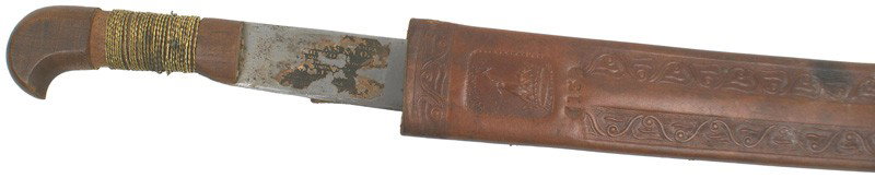 Spanish-American War period machete: K-62 Spanish-American War period machete. Twisted brass wire wrapped wood grip. Part of the original "Collins" Company label on the 23 ¾" blade. 2 ¼" wide. Two large pitted areas. About excellent br