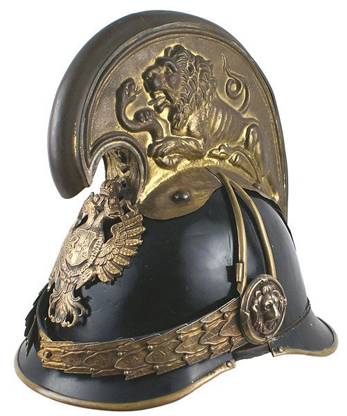 Imperial Austrian M1905 Dragoon helmet: E-1 Austrian M1905 Dragoon officer's helmet. Black leather covered metal body and lacquered visors. Brass double-headed Hapsburg eagle ("FJ1" shield on chest) frontplate. Detailed gilt oak leaf chinsc