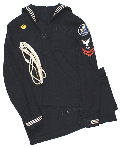 U.S. WWII SEABEES uniform grouping: F-88 WWII "SEABEES" uniform grouping: (1) Dark blue Navy "jumper" with oval "SEABEES" flying bee, wearing a navy cap, insignia. Also Petty Officer 1st Class "patch" with two crossed axes and two red s