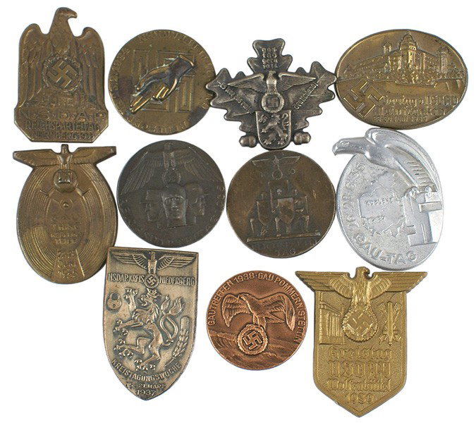 Lot 11 German WWII NSDAP tinnies etc: B-165 Lot of 11 N.S.D.A.P. badges and "tinnies". Includes: (1) Badges - 1933 Nurnberg, "1934 GAU MITTELFRANKEN" Loyalty Day, 1935 and 1936 "REICHSPARTEITAG". (2) "Tinnies" - 1934 Hess Gautag, "Gautag�